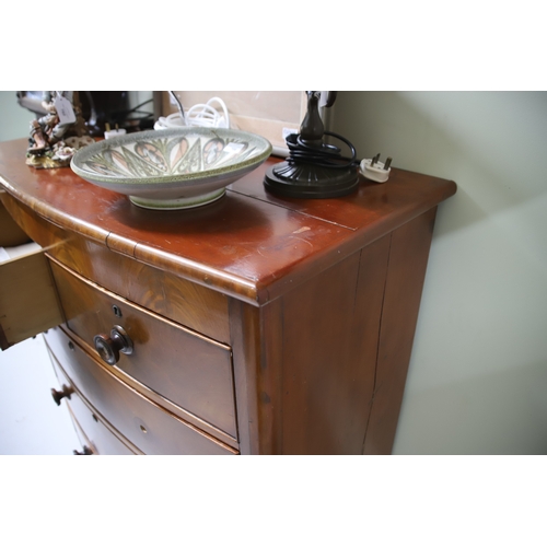 1705 - Bow Fronted chest with Burr Walnut Veneer, (Missing one handle) turned bun feet. See photos for cond... 