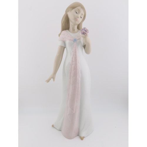 14 - Two Nao figurines of girls plus one by Nadal, the tallest stands 10