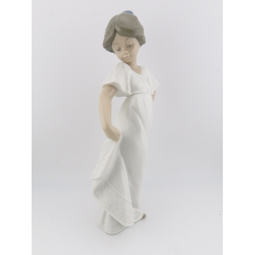 14 - Two Nao figurines of girls plus one by Nadal, the tallest stands 10