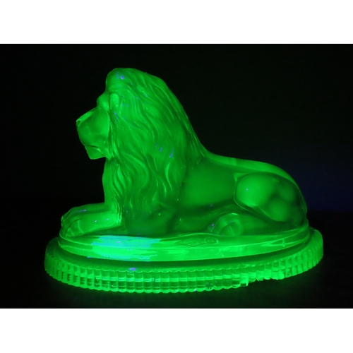19 - Victorian John Derbyshire moulded Uranium glass lion with registration lozenger to the base. (chip t... 