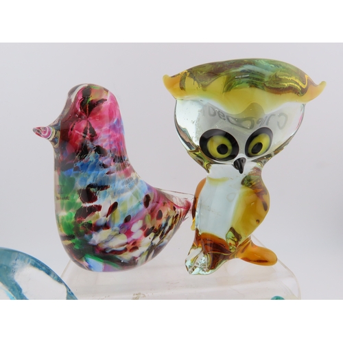 27 - Four art glass paperweights, Caithness, Murano and Avondale glass.