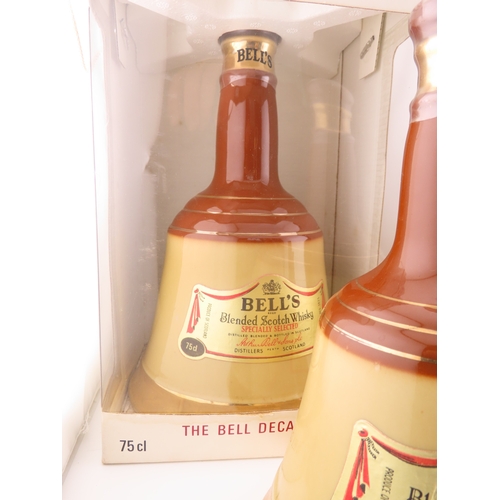 42 - Five Full sealed Bells whisky Wade bell decanters, various sizes and one still boxed.