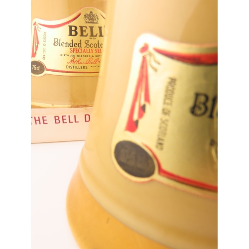 42 - Five Full sealed Bells whisky Wade bell decanters, various sizes and one still boxed.