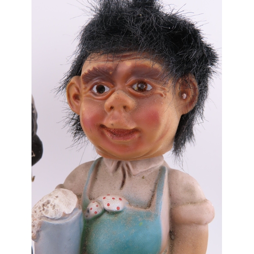 53 - Vintage Kewpie bobblehead money bank and a German bobble head figure.