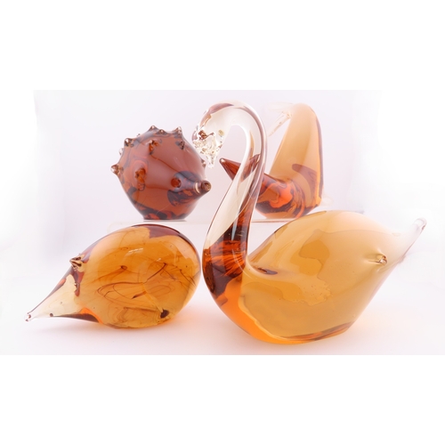 59 - Four Peach art glass animal paperweights.