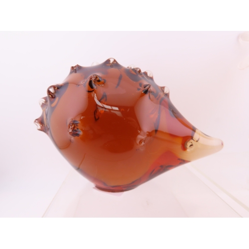 59 - Four Peach art glass animal paperweights.