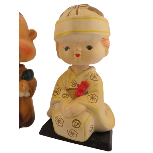 61 - Two Vintage Japanese bobble head figurines.
