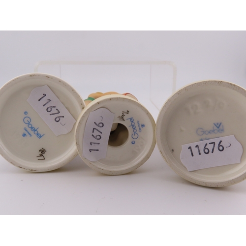 8 - Five Goebel Hummel figurines.