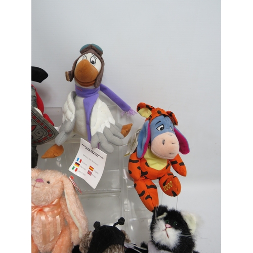 Assorted plush toys including Disney characters (Pluto, Goofy, Eeyore ...