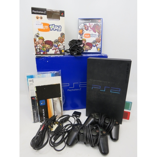 Sony PlayStation 2 console with EyeToy Play and accessories