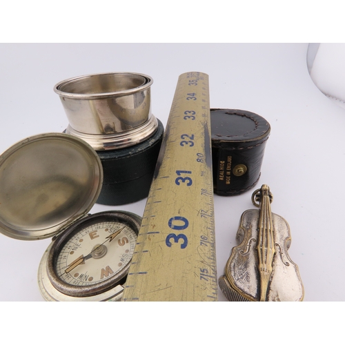 294 - White metal vesta case, folding stirrup cup, tape measure and small compass, assorted early 20th cen... 