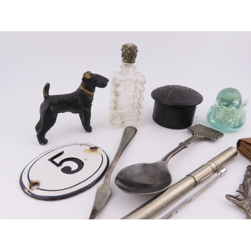 295 - Assorted curios including metal dog figure, enamel number plaque, lidded trinket, scent bottle, and ... 
