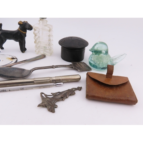 295 - Assorted curios including metal dog figure, enamel number plaque, lidded trinket, scent bottle, and ... 