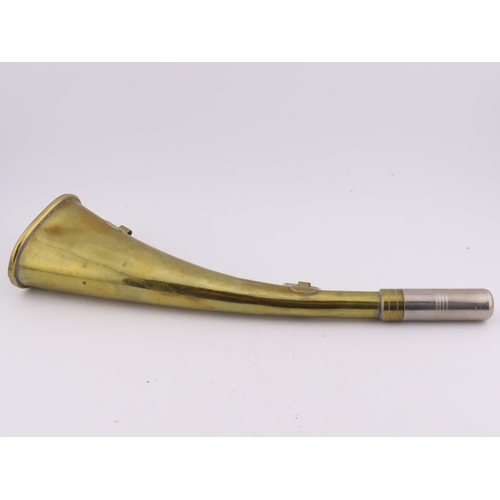 503 - A Brass 9 inch long horn with wall mounting hooks.