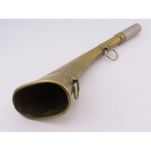 503 - A Brass 9 inch long horn with wall mounting hooks.