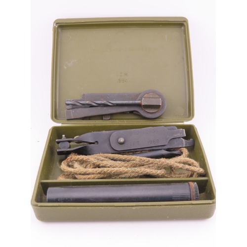 504 - Military issue rifle cleaning kit in olive drab case, complete with tools and rope pull, dated 1968.