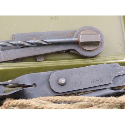 504 - Military issue rifle cleaning kit in olive drab case, complete with tools and rope pull, dated 1968.