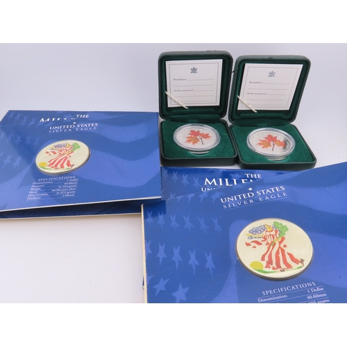 508 - Two Canadian 1oz silver maple leaf coins in cases, together with two USA Millennium Silver Eagles in... 