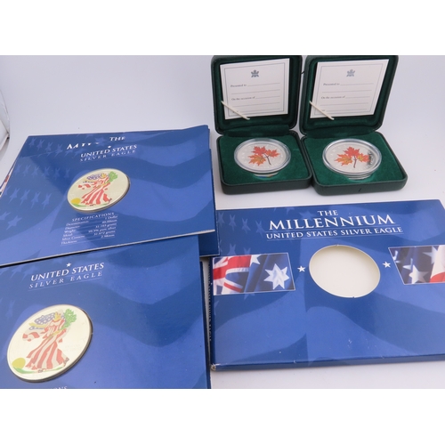 508 - Two Canadian 1oz silver maple leaf coins in cases, together with two USA Millennium Silver Eagles in... 