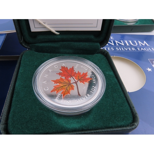 508 - Two Canadian 1oz silver maple leaf coins in cases, together with two USA Millennium Silver Eagles in... 
