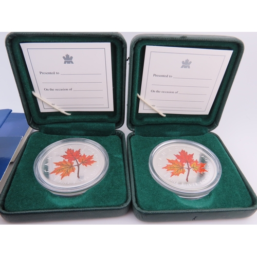 508 - Two Canadian 1oz silver maple leaf coins in cases, together with two USA Millennium Silver Eagles in... 