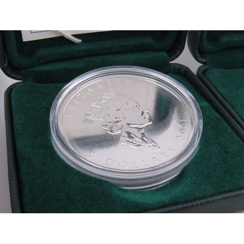 508 - Two Canadian 1oz silver maple leaf coins in cases, together with two USA Millennium Silver Eagles in... 
