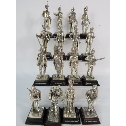 467 - Group of military-themed metal figurines depicting various British Army regiments, including Scots G... 