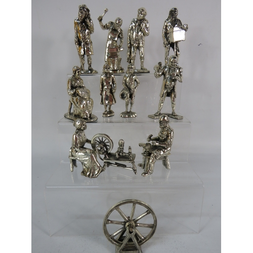 469 - Group of metal figurines depicting historical figures and trades, including spinners, musicians, and... 