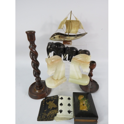 473 - Mixed group of decorative items including carved onyx horse heads, wooden twist candlesticks, a horn... 