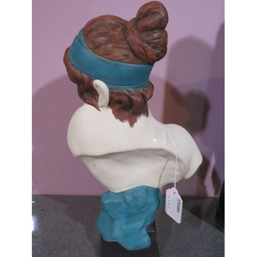483 - Decorative ceramic bust of a young woman with reddish-brown hair and a turquoise headband and drape,... 