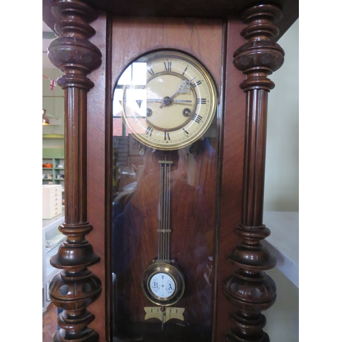 490 - Carved walnut Vienna-style wall clock, approx. 38 inches tall.