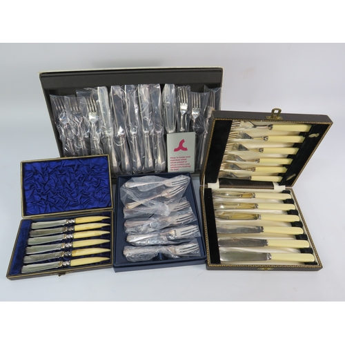 493 - Assorted boxed cutlery sets, including bone-handled and silver-plated examples.