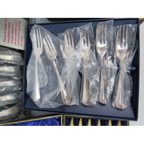 493 - Assorted boxed cutlery sets, including bone-handled and silver-plated examples.