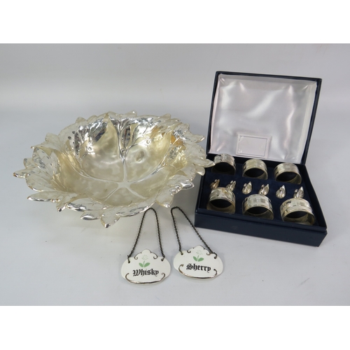 494 - Silver-plated leaf form serving bowl with napkin rings and decanter labels.