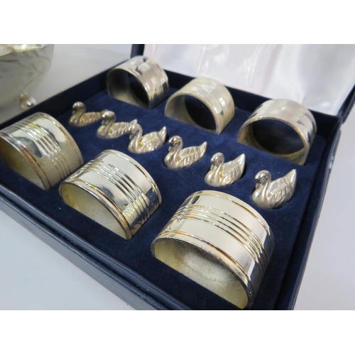 494 - Silver-plated leaf form serving bowl with napkin rings and decanter labels.