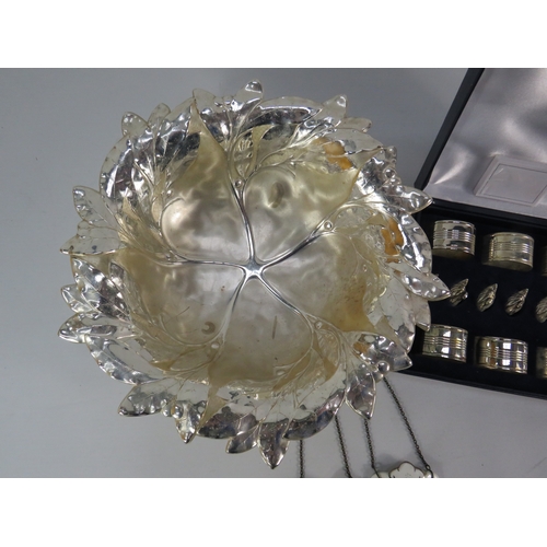 494 - Silver-plated leaf form serving bowl with napkin rings and decanter labels.