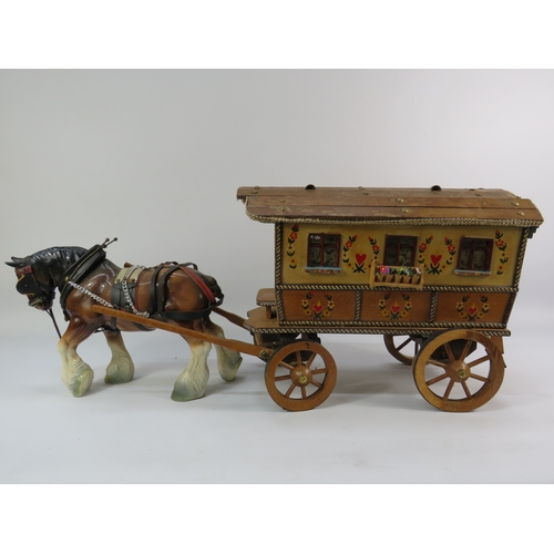 499 - Painted model of a horse and gypsy caravan, approx. 30 inches long.