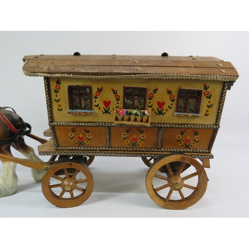 499 - Painted model of a horse and gypsy caravan, approx. 30 inches long.