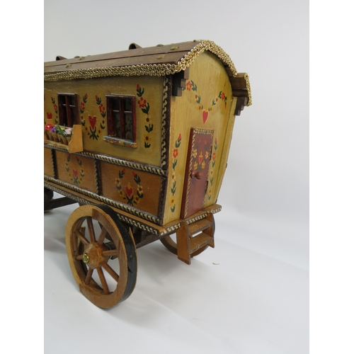 499 - Painted model of a horse and gypsy caravan, approx. 30 inches long.