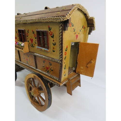 499 - Painted model of a horse and gypsy caravan, approx. 30 inches long.