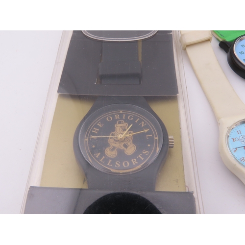 513a - Assorted novelty and character wristwatches, including Disney, Snoopy, and others.
