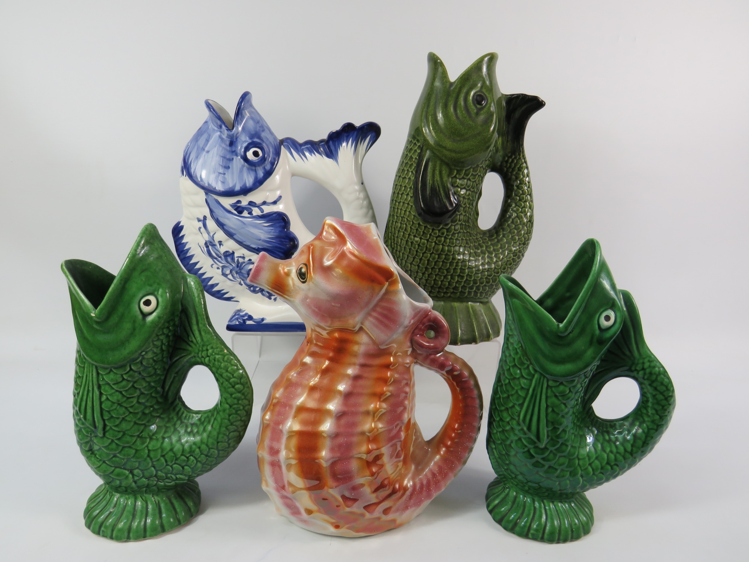 Five Fish-Shape Jugs tallest 13 inches. Selection of whimsical fish and ...