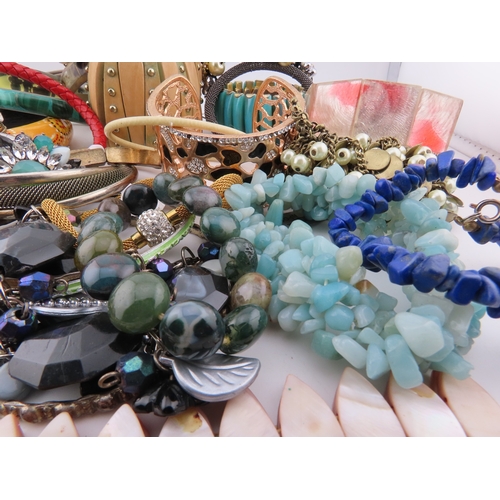78 - A Collection of Bracelets including Semi Precious Stones A diverse selection incorporating glass bea... 