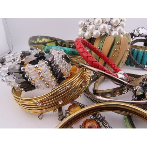 78 - A Collection of Bracelets including Semi Precious Stones A diverse selection incorporating glass bea... 