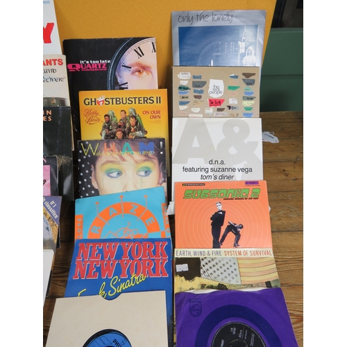 557 - Large collection of 85+ vinyl 7-inch singles (45 RPM records) featuring various artists predominantl... 