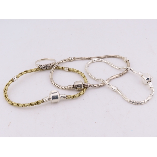 100 - A group of 925 silver bracelets and a ring, comprising two silver snake-link bracelets, a silver and... 