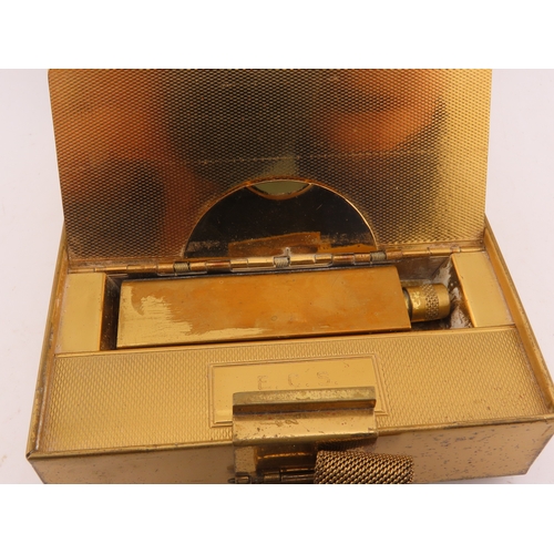 110 - A Park Lane gilt metal cigarette and compact case, circa 1930, the hinged case opening to reveal twi... 