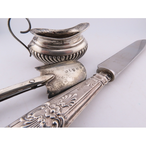 124 - A Georgian silver Stilton scoop with polished bone handle, together with a silver-handled cake knife... 