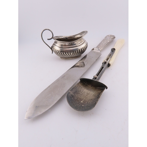 124 - A Georgian silver Stilton scoop with polished bone handle, together with a silver-handled cake knife... 