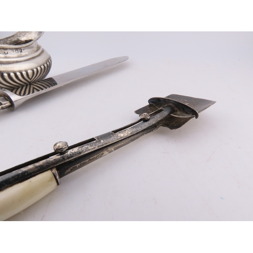 124 - A Georgian silver Stilton scoop with polished bone handle, together with a silver-handled cake knife... 